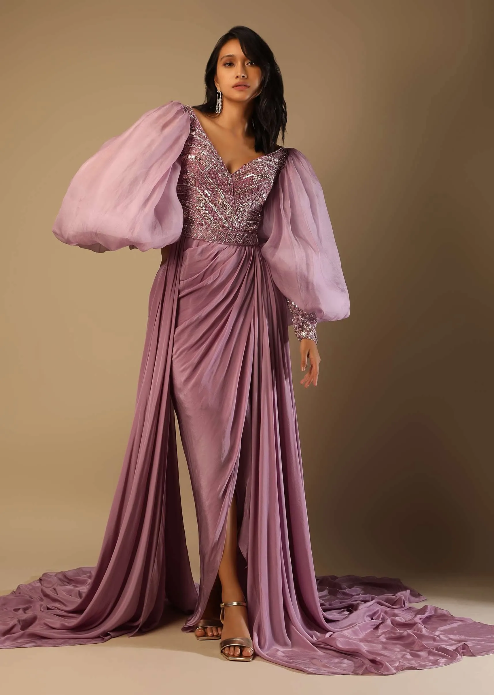 Frozen Mauve Gown With Hand Embroidered Bodice, Balloon Sleeves And A Long Trail