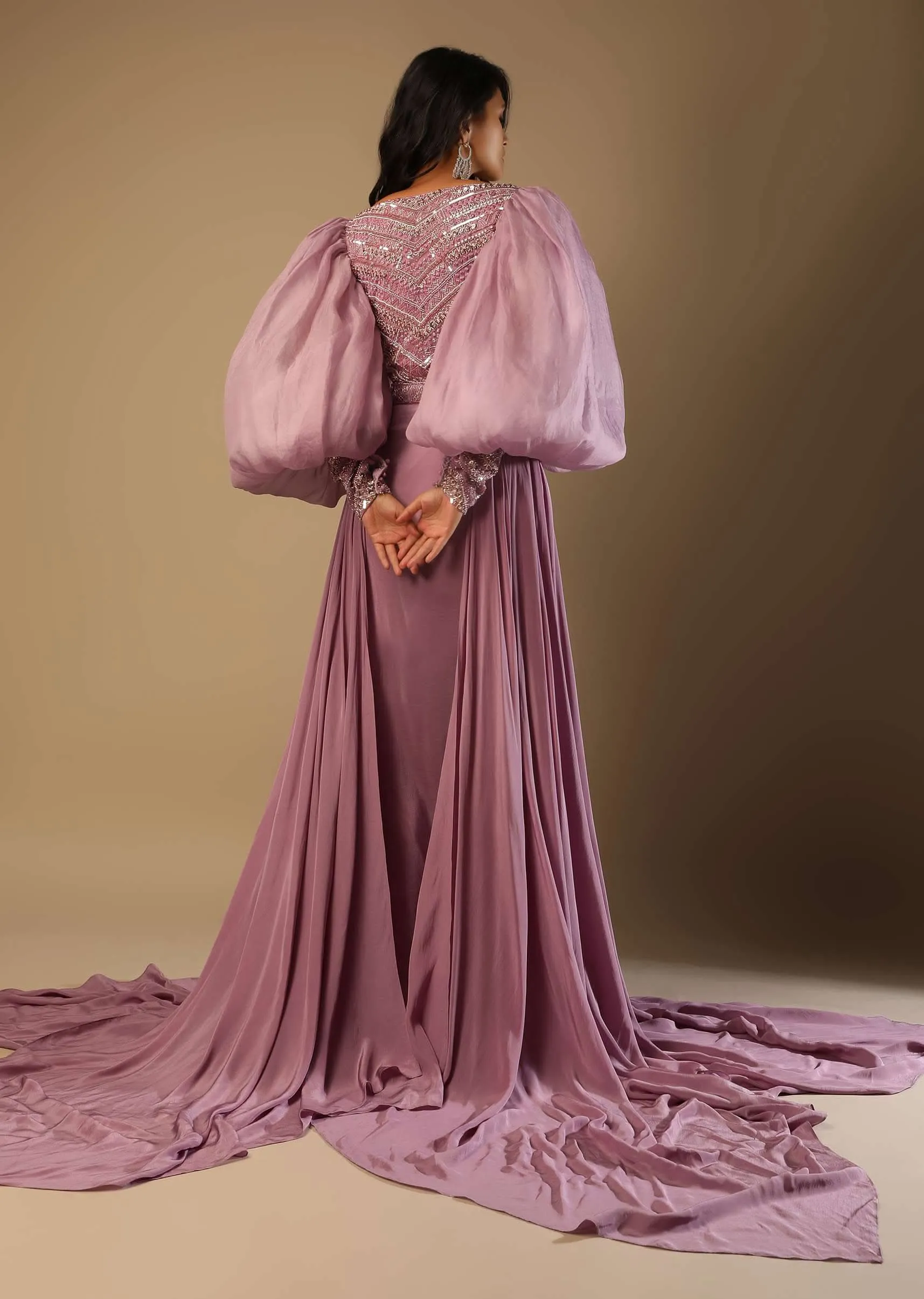 Frozen Mauve Gown With Hand Embroidered Bodice, Balloon Sleeves And A Long Trail