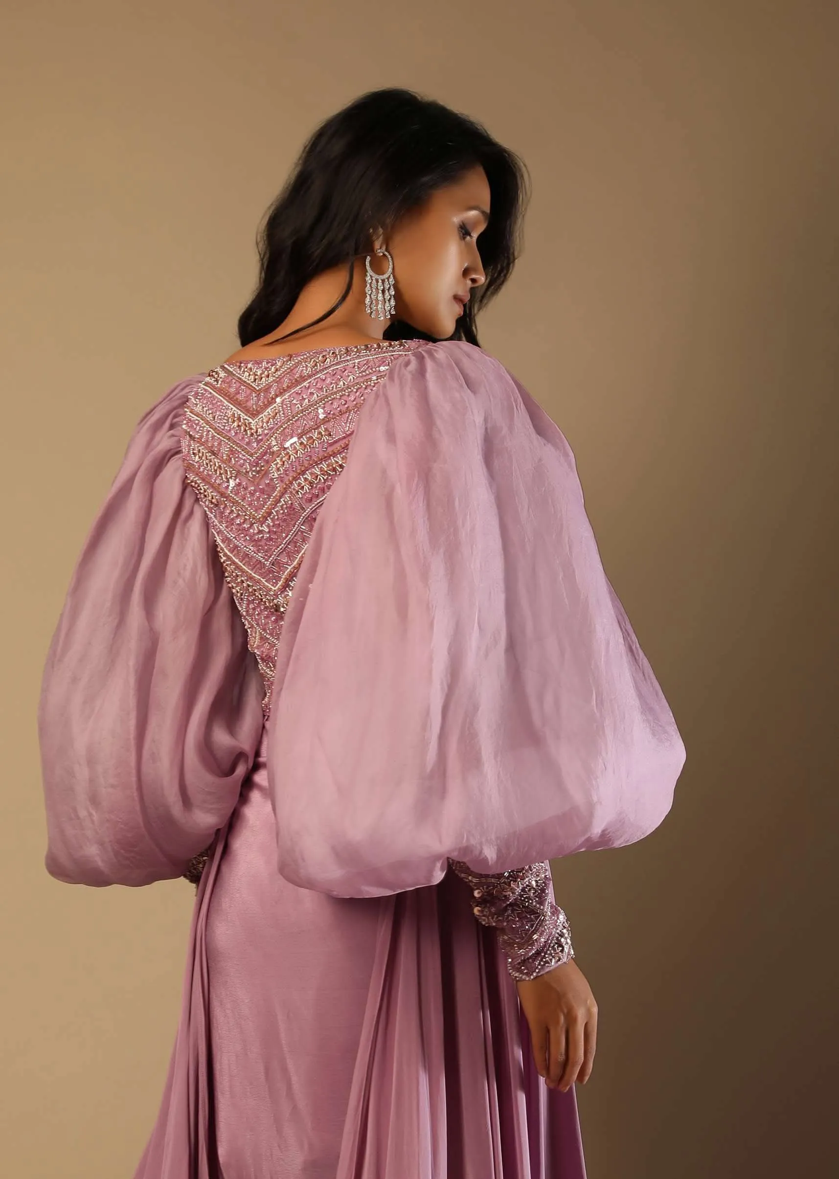 Frozen Mauve Gown With Hand Embroidered Bodice, Balloon Sleeves And A Long Trail
